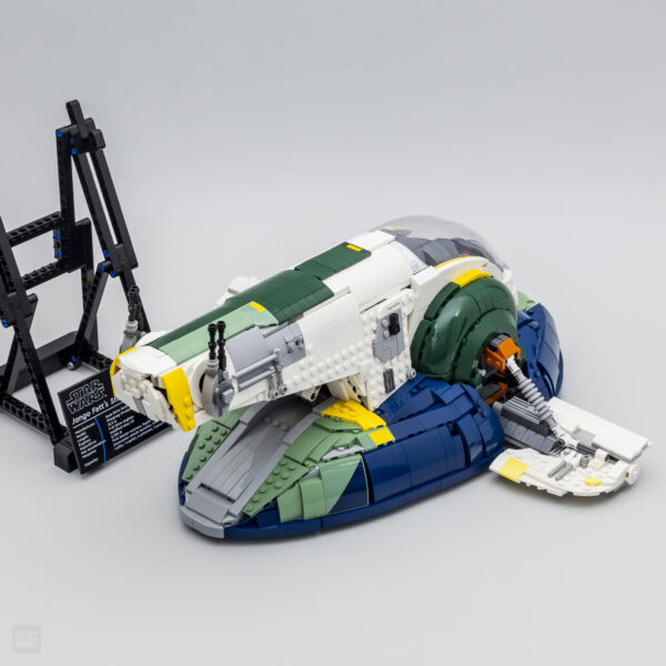 Jango Fett's Star Wars spaceship LEGO model, detailed replica built with LEGO bricks, featuring intricate design and authentic elements, displayed on a plain background.